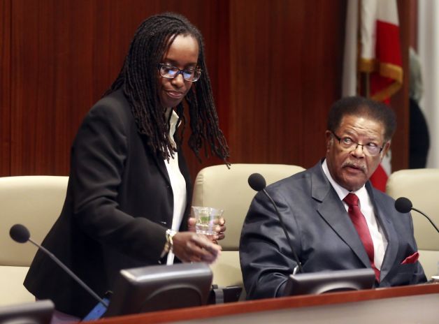 Richmond Vice Mayor Jovanka Beckles (left) sits down next to Councilman Nat Bates. Beckles is the city's first openly lesbian councilwoman and has often endured ridicule. Photo: Carlos Avila Gonzalez, The Chronicle